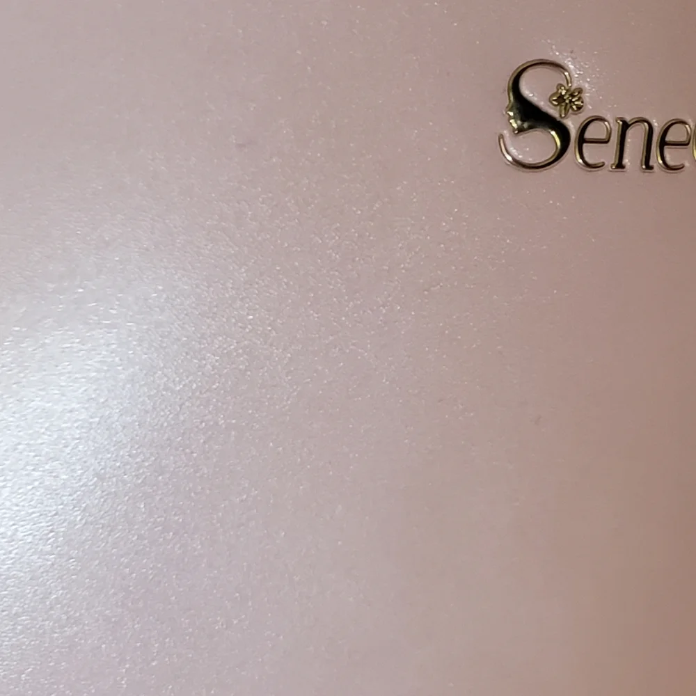 SeneGence pearlized pink vinyl makeup bag with skin care samples